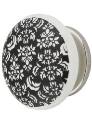 White Porcelain Floral Cabinet Knob with Brass Base in Polished Nickel.